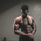 Muscular black male flexing